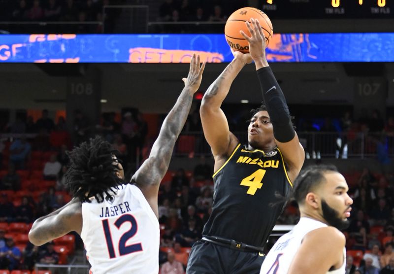 Feb 14, 2023; Auburn, Alabama, USA;  Missouri Tigers guard DeAndre Gholston (4) shoots over Auburn Tigers guard Zep Jasper (12) during the first half at Neville Arena. Mandatory Credit: Julie Bennett-USA TODAY Sports