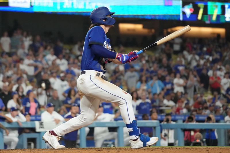 Jul 25, 2023; Los Angeles, California, USA; Los Angeles Dodgers center fielder James Outman (33) follows through on a walk-off double in the 10th inning against the Toronto Blue Jays at Dodger Stadium. Mandatory Credit: Kirby Lee-USA TODAY Sports