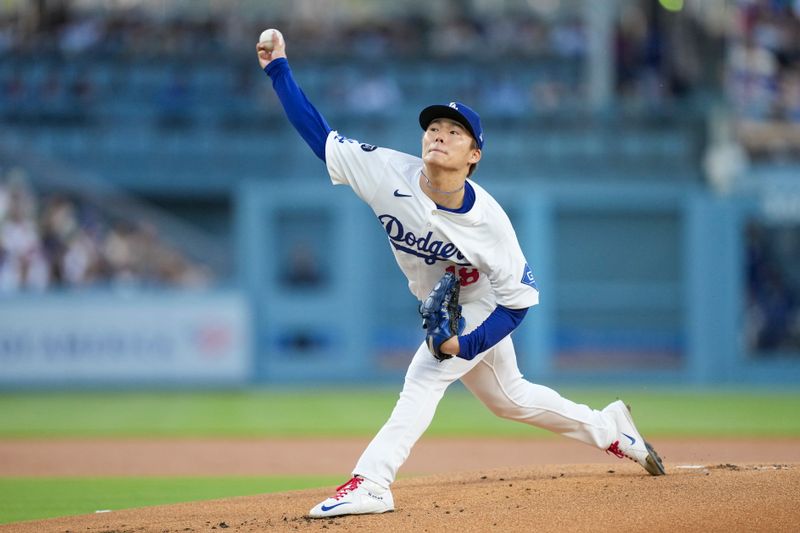 May 20, 2025; Los Angeles, California, USA; Los Angeles Dodgers pitcher Yoshinobu Yamamoto (18) throws a pitch in the first inning against the Arizona Diamondbacks at Dodger Stadium. Mandatory Credit: Kirby Lee-Imagn Images