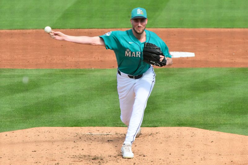 Feb 20, 2026; Peoria, Arizona, USA; Seattle Mariners pitcher Cooper Criswell (18) throws in the third inning against the San Diego Padres during a Spring Training game at Peoria Sports Complex. Mandatory Credit: Matt Kartozian-Imagn Images