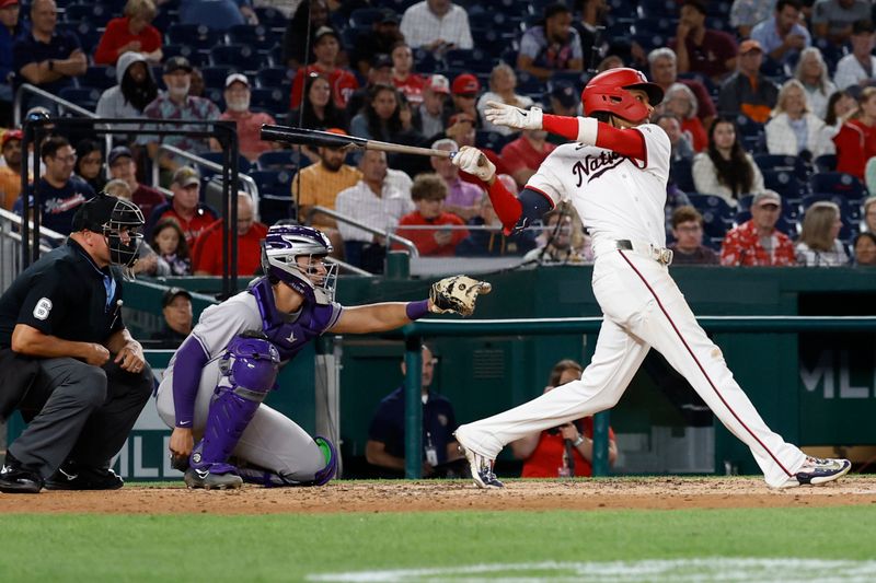 Aug 20, 2024; Washington, District of Columbia, USA; Washington Nationals shortstop CJ Abrams (5) hits a solo home run against the Colorado Rockies during the sixth inning at Nationals Park. Mandatory Credit: Geoff Burke-USA TODAY Sports