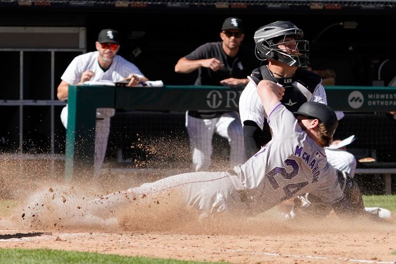 Jun 30, 2024; Chicago, Illinois, USA; Colorado Rockies third base Ryan McMahon (24) scores the go ahead run as Chicago White Sox catcher Korey Lee (26) makes a late tag during the fourteenth inning at Guaranteed Rate Field. Mandatory Credit: David Banks-USA TODAY Sports