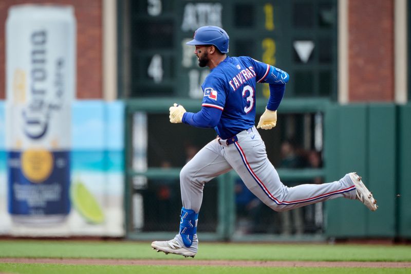 Apr 27, 2025; San Francisco, California, USA; Texas Rangers outfielder Leody Taveras (3) runs toward second base with a double against the San Francisco Giants during the fifth inning at Oracle Park. Mandatory Credit: Robert Edwards-Imagn Images