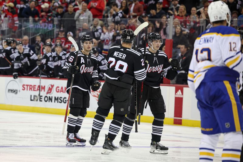 Oct 27, 2023; Newark, New Jersey, USA; New Jersey Devils center Jack Hughes (86) celebrates his goal with teammates during the third period against the Buffalo Sabres at Prudential Center. Mandatory Credit: Vincent Carchietta-USA TODAY Sports