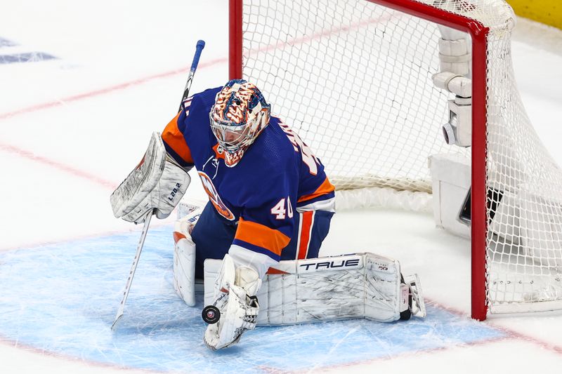 Apr 27, 2024; Elmont, New York, USA; New York Islanders goaltender Semyon Varlamov (40) makes a save on a shot on goal attempt in the first period against the Carolina Hurricanes in game four of the first round of the 2024 Stanley Cup Playoffs at UBS Arena. Mandatory Credit: Wendell Cruz-USA TODAY Sports