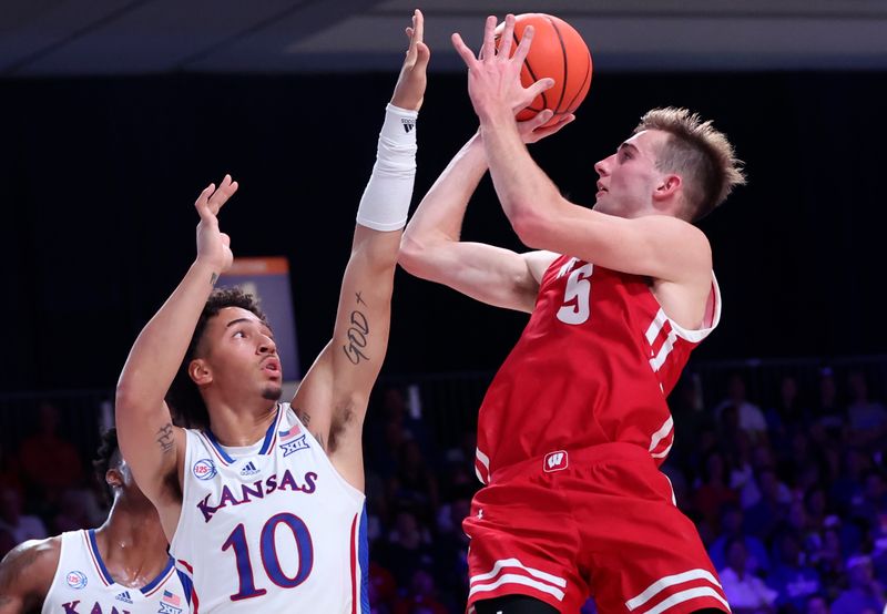 Nov 24, 2022; Paradise Island, BAHAMAS; Wisconsin Badgers forward Tyler Wahl (5) shoots over Kansas Jayhawks forward Jalen Wilson (10) during the second half at Imperial Arena. Mandatory Credit: Kevin Jairaj-USA TODAY Sports