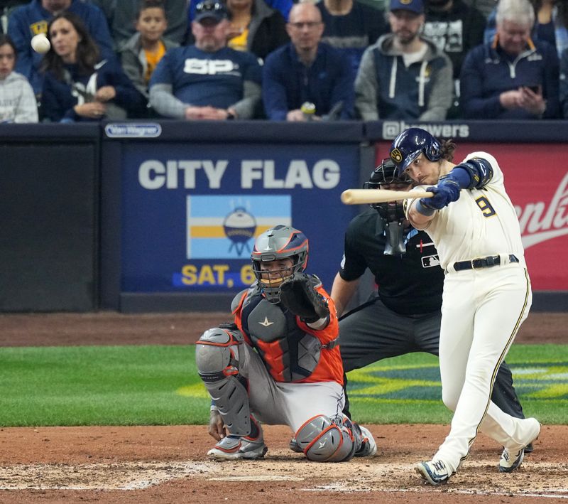 May 24, 2023; Milwaukee, Wisconsin, USA; Milwaukee Brewers third baseman Brian Anderson (9) hits a solo home run during the seventh inning of their game against the Houston Astros at American Family Field. Mandatory Credit: Mark Hoffman-USA TODAY Sports