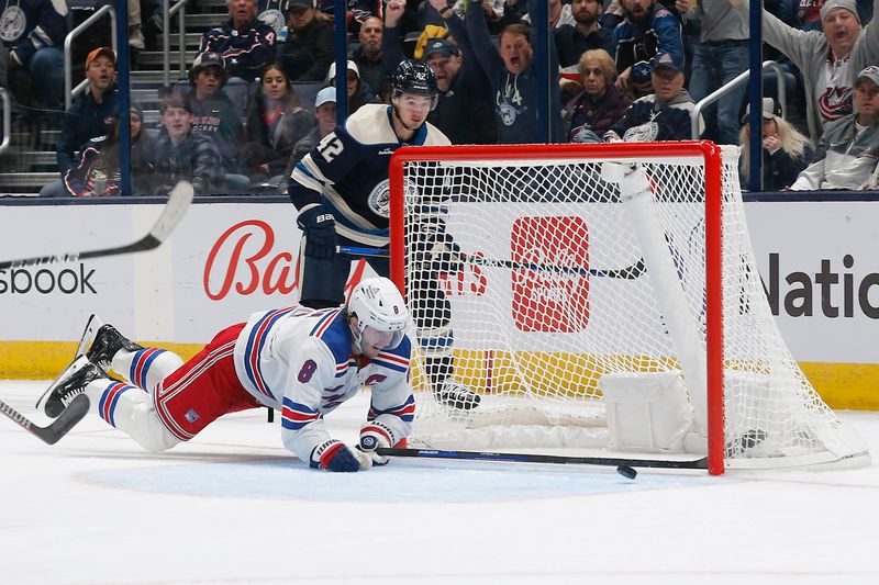 Oct 14, 2023; Columbus, Ohio, USA; New York Rangers defenseman Jacob Trouba (8) dives to stop a goal against the Columbus Blue Jackets during the first period at Nationwide Arena. Mandatory Credit: Russell LaBounty-USA TODAY Sports