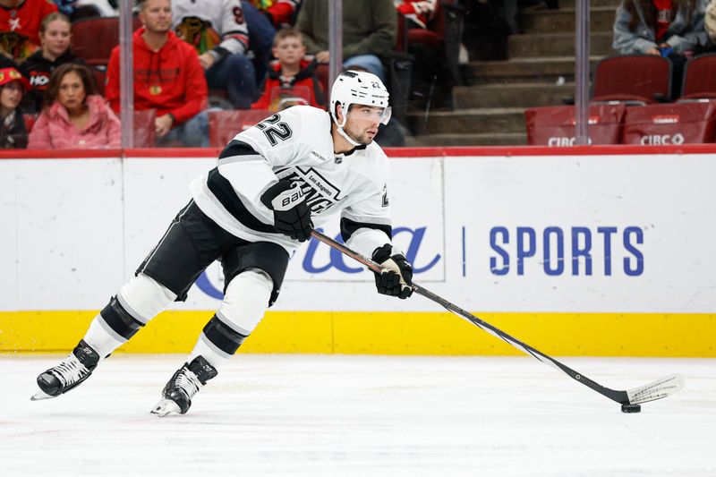 Oct 26, 2025; Chicago, Illinois, USA; Los Angeles Kings left wing Kevin Fiala (22) looks to pass the puck against the Chicago Blackhawks during the first period at United Center. Mandatory Credit: Kamil Krzaczynski-Imagn Images