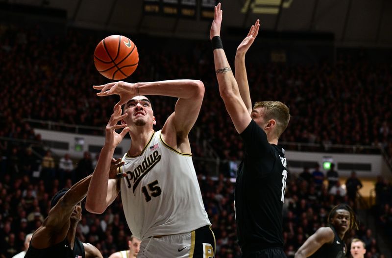 Mar 2, 2024; West Lafayette, Indiana, USA; Purdue Boilermakers center Zach Edey (15) loses control of the ball in front of Michigan State Spartans center Carson Cooper (15) during the second half at Mackey Arena. Mandatory Credit: Marc Lebryk-USA TODAY Sports