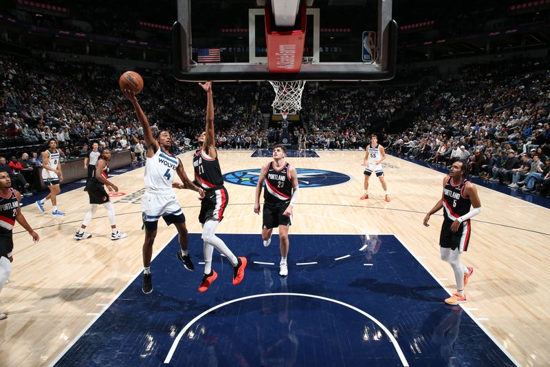 MINNEAPOLIS, MN - NOVEMBER 8: Rob Dillingham #4 of the Minnesota Timberwolves drives to the basket during the game against the Portland Trail Blazers on November 8, 2024 at Target Center in Minneapolis, Minnesota. NOTE TO USER: User expressly acknowledges and agrees that, by downloading and or using this Photograph, user is consenting to the terms and conditions of the Getty Images License Agreement. Mandatory Copyright Notice: Copyright 2024 NBAE (Photo by David Sherman/NBAE via Getty Images)