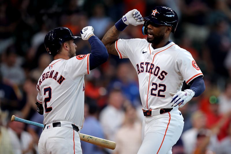 Sep 12, 2024; Houston, Texas, USA; Houston Astros right fielder Jason Heyward (22) is congratulated by Houston Astros third baseman Alex Bregman (2) after hitting a two-run home run to right field against the Oakland Athletics during the second inning at Minute Maid Park. Mandatory Credit: Erik Williams-Imagn Images
