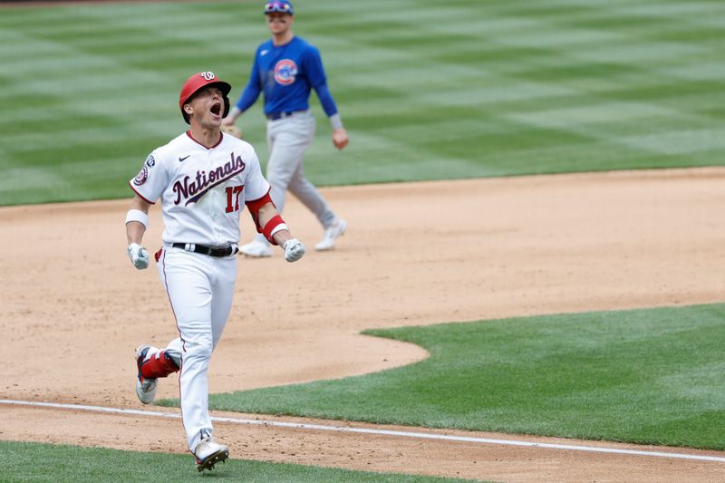 May 4, 2023; Washington, District of Columbia, USA; Washington Nationals left fielder Alex Call (17) celebrates while rounding the bases after hitting a walk-off home run as Chicago Cubs second baseman Nico Hoerner (2) leaves the field at Nationals Park. Mandatory Credit: Geoff Burke-USA TODAY Sports