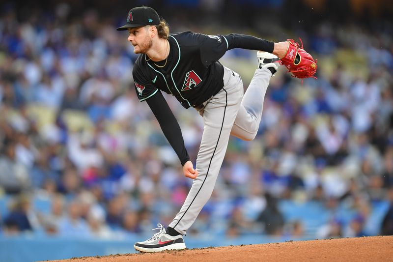 May 22, 2024; Los Angeles, California, USA; Arizona Diamondbacks Arizona Diamondbacks pitcher Ryne Nelson (19) throws against the Los Angeles Dodgers during the first inning at Dodger Stadium. Mandatory Credit: Gary A. Vasquez-USA TODAY Sports