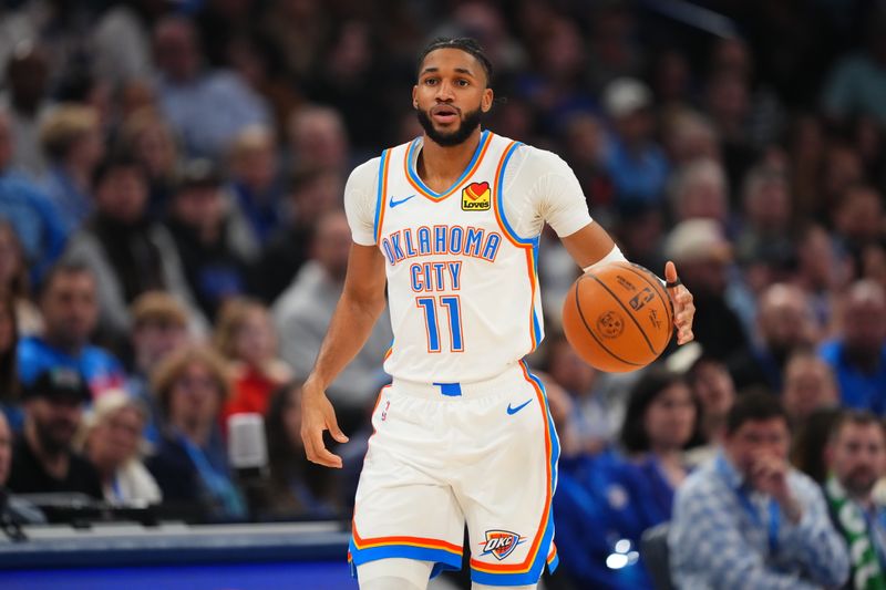 OKLAHOMA CITY, OK - FEBRUARY 5:  Isaiah Joe #11 of the Oklahoma City Thunder dribbles the ball during the game against the Phoenix Suns  on February 5, 2025 at Paycom Center in Oklahoma City, Oklahoma. NOTE TO USER: User expressly acknowledges and agrees that, by downloading and or using this photograph, User is consenting to the terms and conditions of the Getty Images License Agreement. Mandatory Copyright Notice: Copyright 2025 NBAE (Photo by Cooper Neill/NBAE via Getty Images)