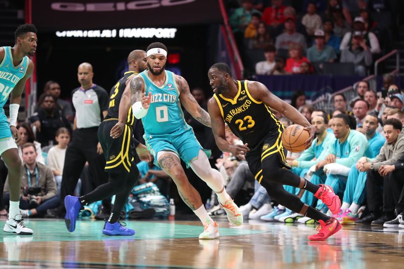 CHARLOTTE, NC - MARCH 29:  Draymond Green #23 of the Golden State Warriors handles the ball during the game against the Charlotte Hornets on March 29, 2024 at Spectrum Center in Charlotte, North Carolina. NOTE TO USER: User expressly acknowledges and agrees that, by downloading and or using this photograph, User is consenting to the terms and conditions of the Getty Images License Agreement.  Mandatory Copyright Notice:  Copyright 2024 NBAE (Photo by Brock Williams-Smith/NBAE via Getty Images)