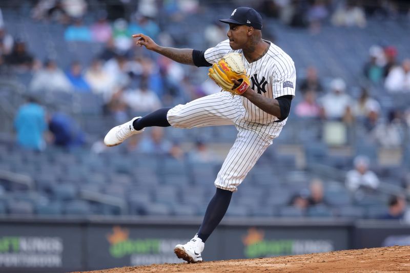 Aug 7, 2024; Bronx, New York, USA; New York Yankees relief pitcher Enyel de los Santos (62) follows through on a pitch against the Los Angeles Angels during the sixth inning at Yankee Stadium. Mandatory Credit: Brad Penner-USA TODAY Sports