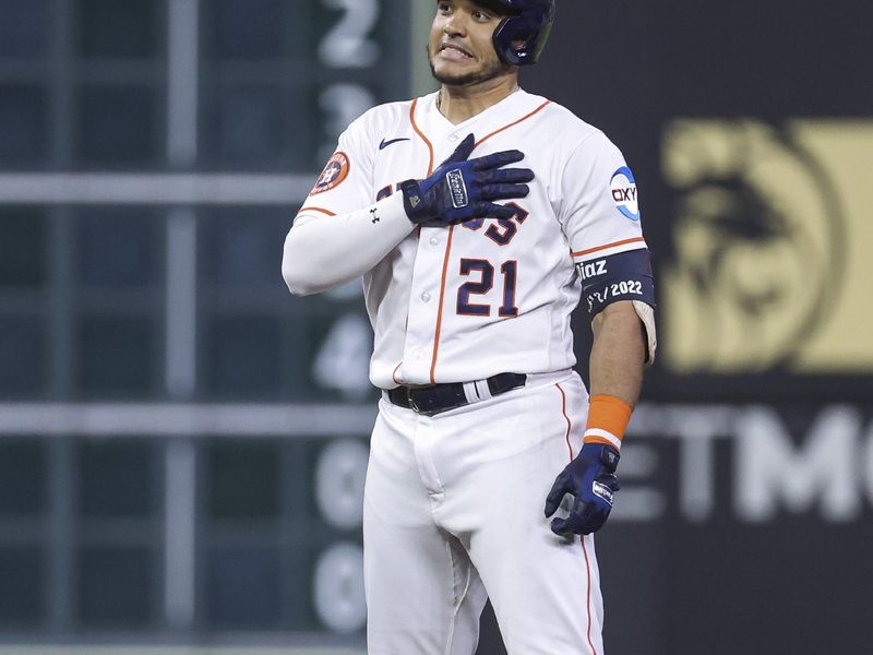 Aug 22, 2023; Houston, Texas, USA; Houston Astros designated hitter Yainer Diaz (21) reacts after hitting a single and reaching second base on an error during the seventh inning against the Boston Red Sox at Minute Maid Park. Mandatory Credit: Troy Taormina-USA TODAY Sports