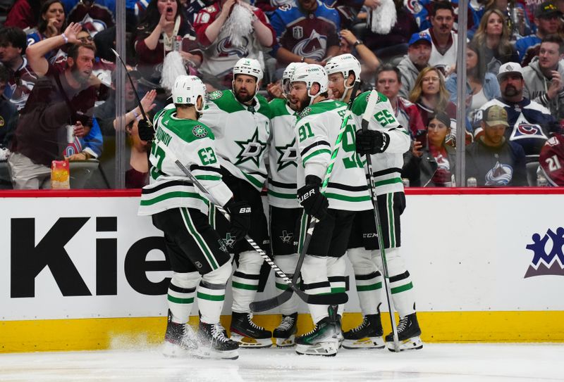 May 17, 2024; Denver, Colorado, USA; Dallas Stars left wing Jamie Benn (14) celebrates his goal scored with center Tyler Seguin (91) and defenseman Thomas Harley (55) and right wing Evgenii Dadonov (63) and defenseman Miro Heiskanen (4)  in the third period against the Colorado Avalanche in game six of the second round of the 2024 Stanley Cup Playoffs at Ball Arena. Mandatory Credit: Ron Chenoy-USA TODAY Sports