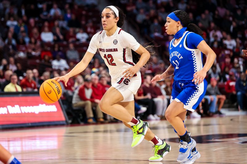 Feb 2, 2023; Columbia, South Carolina, USA; South Carolina Gamecocks guard Brea Beal (12) drives around Kentucky Wildcats guard Jada Walker (11) in the first half at Colonial Life Arena. Mandatory Credit: Jeff Blake-USA TODAY Sports