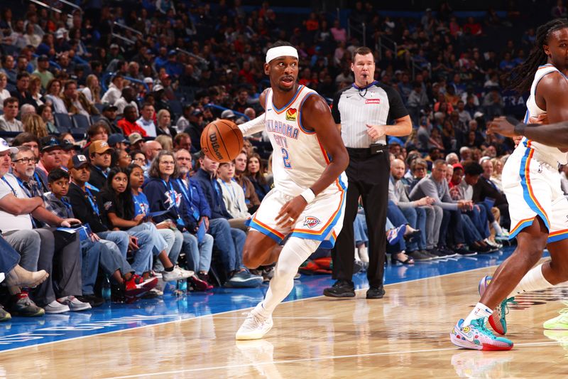 OKLAHOMA CITY, OK - OCTOBER 17: Shai Gilgeous-Alexander #2 of the Oklahoma City Thunder looks to pass the ball during the game against the Atlanta Hawks on October 17, 2024 at Paycom Arena in Oklahoma City, Oklahoma. NOTE TO USER: User expressly acknowledges and agrees that, by downloading and or using this photograph, User is consenting to the terms and conditions of the Getty Images License Agreement. Mandatory Copyright Notice: Copyright 2024 NBAE (Photo by Zach Beeker/NBAE via Getty Images)