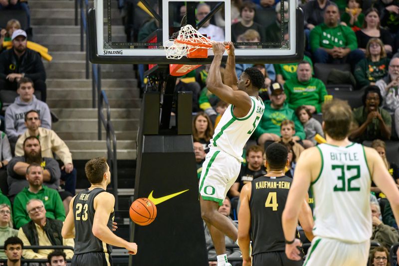 Jan 18, 2025; Eugene, Oregon, USA; Oregon Ducks guard TJ Bamba (5) dunks the ball against the Purdue Boilermakers during the second half at Matthew Knight Arena. Mandatory Credit: Craig Strobeck-Imagn Images