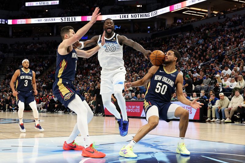 MINNEAPOLIS, MINNESOTA - MARCH 21: Julius Randle #30 of the Minnesota Timberwolves reacts to being fouled by Jeremiah Robinson-Earl #50 of the New Orleans Pelicans in the third quarter at Target Center on March 21, 2025 in Minneapolis, Minnesota. The Timberwolves defeated the Pelicans 134-93. NOTE TO USER: User expressly acknowledges and agrees that, by downloading and or using this photograph, User is consenting to the terms and conditions of the Getty Images License Agreement. (Photo by David Berding/Getty Images)