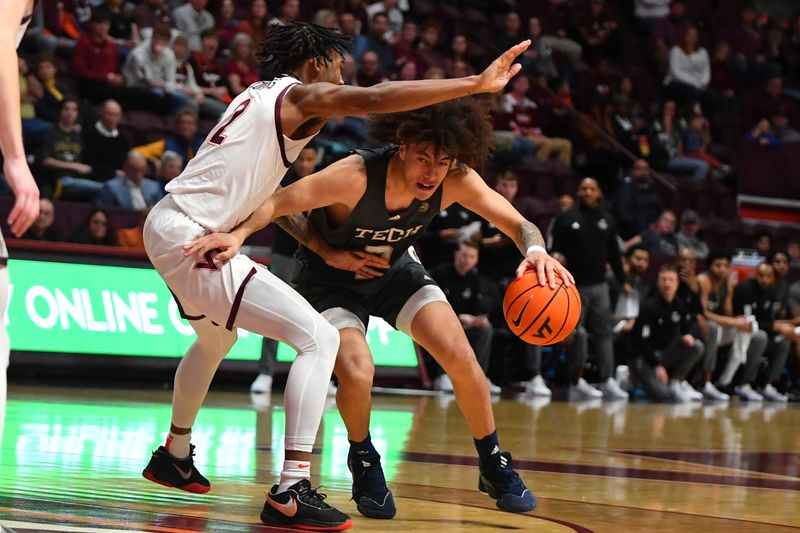 Jan 27, 2024; Blacksburg, Virginia, USA; Georgia Tech Yellow Jackets guard Naithan George (2) drives into the lane while being guarded by Virginia Tech Hokies guard MJ Collins (2) during the second half at Cassell Coliseum. Mandatory Credit: Brian Bishop-USA TODAY Sports