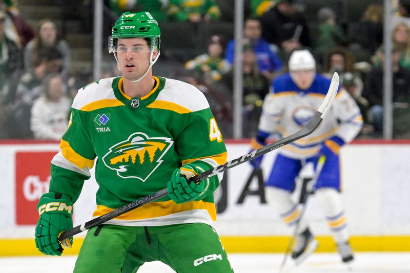 Feb 17, 2024; Saint Paul, Minnesota, USA;  Minnesota Wild defenseman Declan Chisholm (47) follows the play against the Buffalo Sabres during the second period at Xcel Energy Center. Mandatory Credit: Nick Wosika-USA TODAY Sports