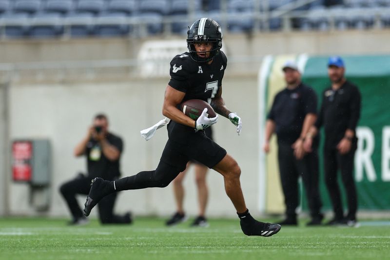 Oct 12, 2024; Orlando, Florida, USA; South Florida Bulls wide receiver Michael Brown-Stephens (7) runs with the ball against the Memphis Tigers in the third quarter at Camping World Stadium. Mandatory Credit: Nathan Ray Seebeck-Imagn Images