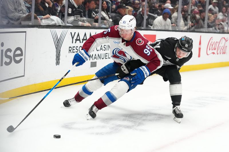 Mar 2, 2026; Los Angeles, California, USA; Colorado Avalanche left wing Victor Olofsson (95) and LA Kings defenseman Angus Booth (81) battle for the puck in the first period at Crypto.com Arena. Mandatory Credit: Kirby Lee-Imagn Images