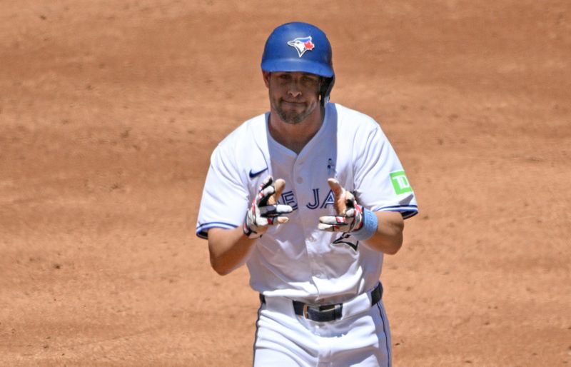 Jun 16, 2024; Toronto, Ontario, CAN;  Toronto Blue Jays third baseman Ernie Clement (28) reacts after hitting a two run home run against the Cleveland Guardians in the second inning at Rogers Centre. Mandatory Credit: Dan Hamilton-USA TODAY Sports