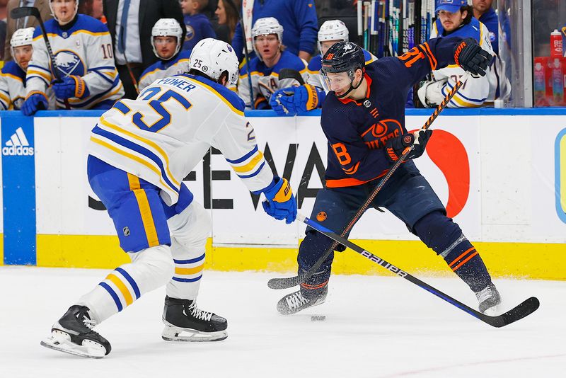 Mar 21, 2024; Edmonton, Alberta, CAN; Edmonton Oilers forward Zach Hyman (18) looks to make a pass in front of Buffalo Sabres defensemen Owen Power (25) during the third period at Rogers Place. Mandatory Credit: Perry Nelson-USA TODAY Sports