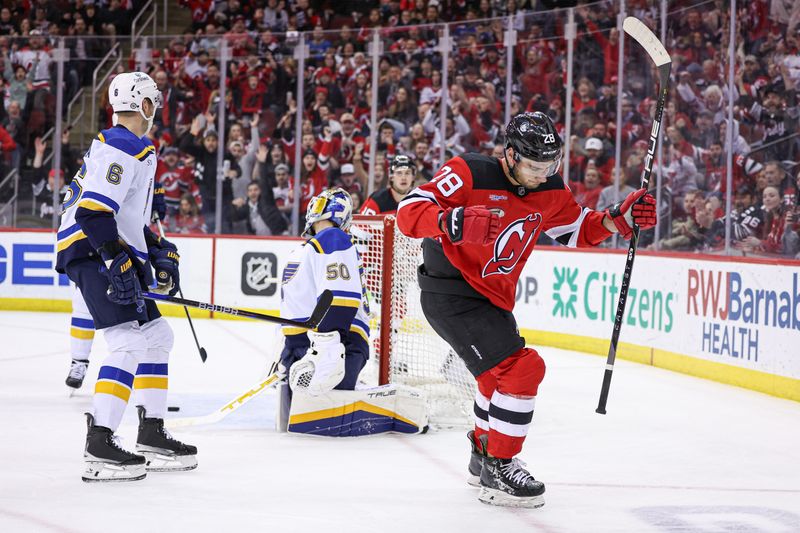 Mar 7, 2024; Newark, New Jersey, USA; New Jersey Devils right wing Timo Meier (28) celebrates his first goal of the game past St. Louis Blues goaltender Jordan Binnington (50) during the first period at Prudential Center. Mandatory Credit: Vincent Carchietta-USA TODAY Sports