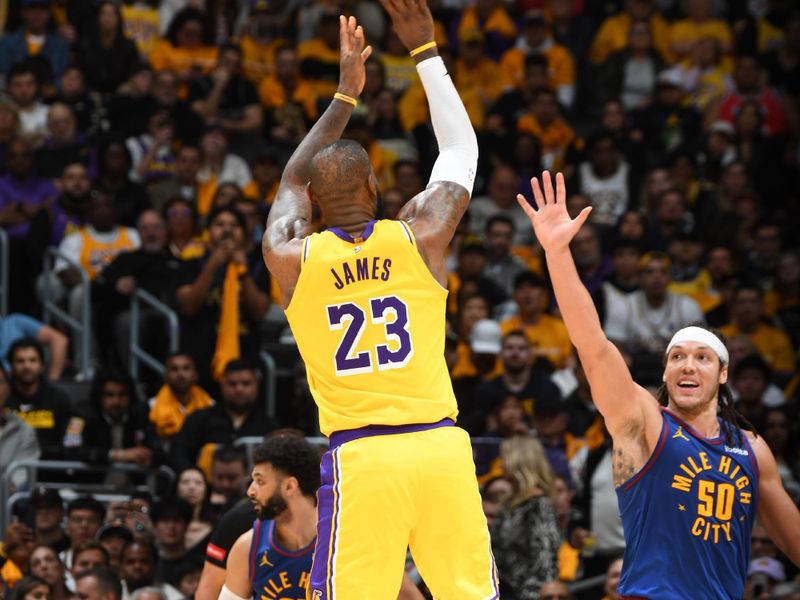 LOS ANGELES, CA - APRIL 25: LeBron James #23 of the Los Angeles Lakers shoots the ball during the game against the Denver Nuggets during Round 1 Game 3 of the 2024 NBA Playoffs on April 25, 2024 at Crypto.Com Arena in Los Angeles, California. NOTE TO USER: User expressly acknowledges and agrees that, by downloading and/or using this Photograph, user is consenting to the terms and conditions of the Getty Images License Agreement. Mandatory Copyright Notice: Copyright 2024 NBAE (Photo by Andrew D. Bernstein/NBAE via Getty Images)