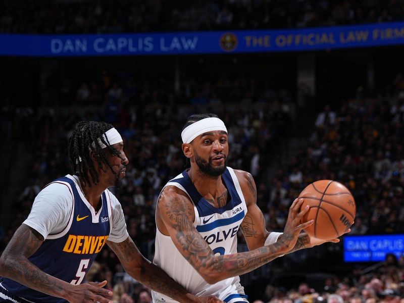 DENVER, CO - APRIL 10: Nickeil Alexander-Walker #9 of the Minnesota Timberwolves passes the ball during the game against the Denver Nuggets on April 10, 2024 at the Ball Arena in Denver, Colorado. NOTE TO USER: User expressly acknowledges and agrees that, by downloading and/or using this Photograph, user is consenting to the terms and conditions of the Getty Images License Agreement. Mandatory Copyright Notice: Copyright 2024 NBAE (Photo by Garrett Ellwood/NBAE via Getty Images)