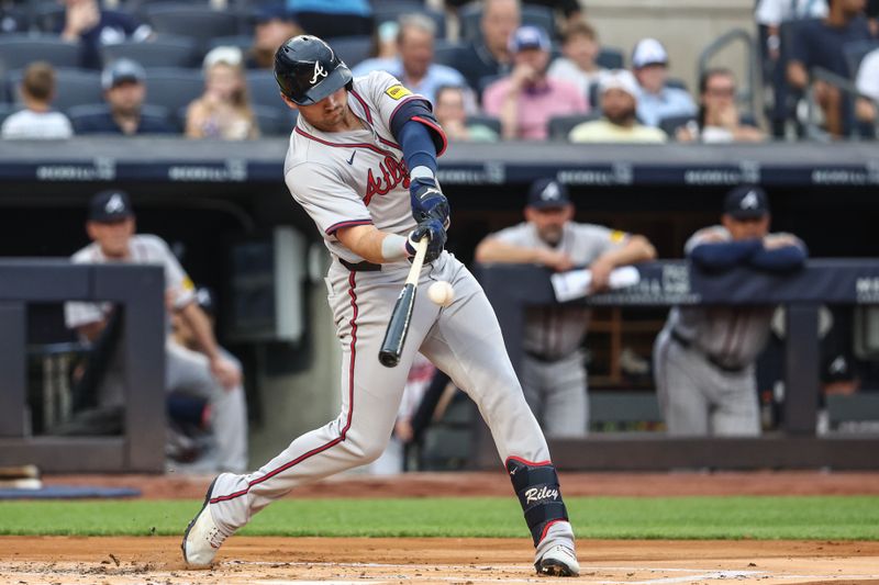 Jun 21, 2024; Bronx, New York, USA; Atlanta Braves third baseman Austin Riley (27) hits a solo home run in the first inning against the New York Yankees at Yankee Stadium. Mandatory Credit: Wendell Cruz-USA TODAY Sports