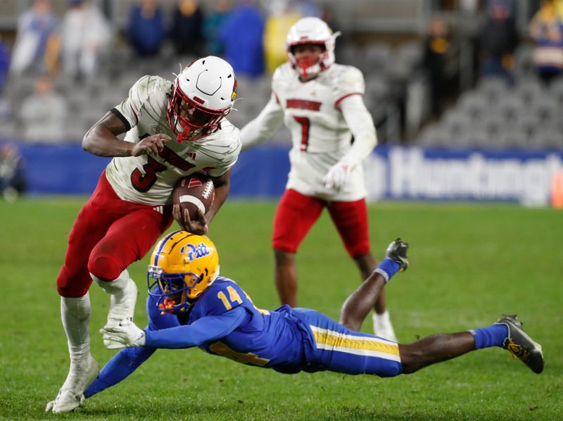 Oct 14, 2023; Pittsburgh, Pennsylvania, USA; Louisville Cardinals wide receiver Kevin Coleman (3) runs after a catch against Pittsburgh Panthers defensive back Marquis Williams (14) during the fourth quarter at Acrisure Stadium. Pittsburgh won 38-21. Mandatory Credit: Charles LeClaire-USA TODAY Sports