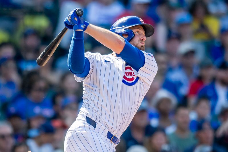 Aug 17, 2024; Chicago, Illinois, USA; Chicago Cubs first base Michael Busch (29) hits a two-run triple during the fifth inning against the Toronto Blue Jays at Wrigley Field. Mandatory Credit: Patrick Gorski-USA TODAY Sports