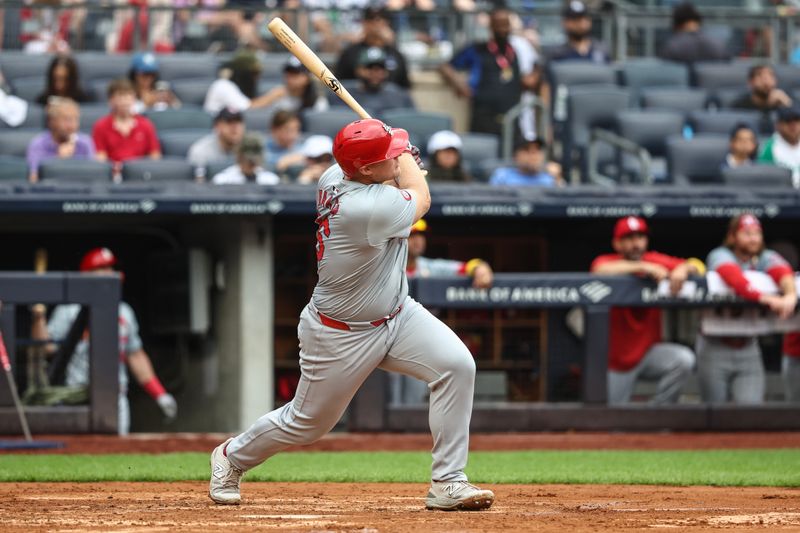 Sep 1, 2024; Bronx, New York, USA;  St. Louis Cardinals designated hitter Luken Baker (26) hits a two run home run in the fourth inning against the New York Yankees at Yankee Stadium. Mandatory Credit: Wendell Cruz-USA TODAY Sports