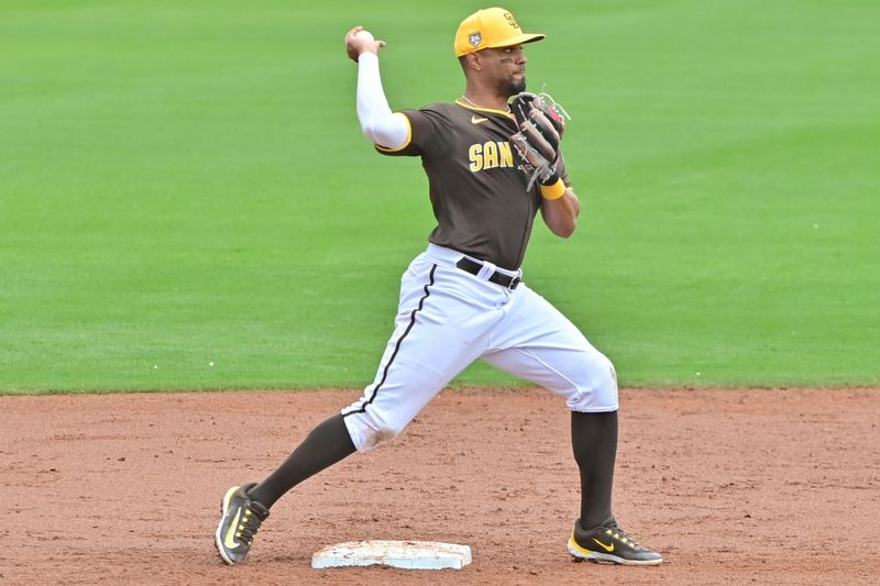 Feb 26, 2024; Peoria, Arizona, USA;  San Diego Padres second baseman Xander Bogaerts (2) turns a double play in the third inning against the Cleveland Guardians during a spring training game at Peoria Sports Complex. Mandatory Credit: Matt Kartozian-USA TODAY Sports