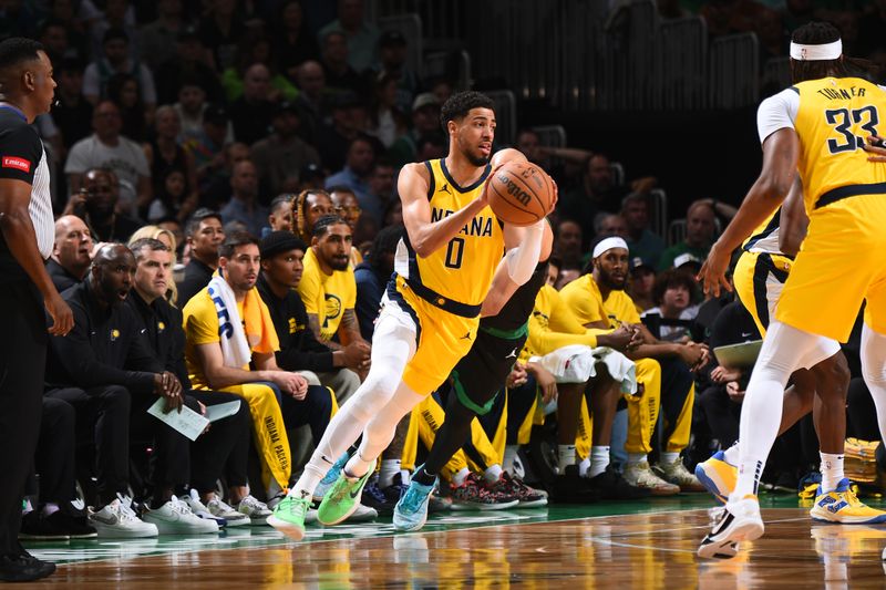 BOSTON, MA - MAY 23: Tyrese Haliburton #0 of the Indiana Pacers handles the ball during the game against the Boston Celtics during Game 2 of the Eastern Conference Finals of the 2024 NBA Playoffs on May 23, 2024 at the TD Garden in Boston, Massachusetts. NOTE TO USER: User expressly acknowledges and agrees that, by downloading and or using this photograph, User is consenting to the terms and conditions of the Getty Images License Agreement. Mandatory Copyright Notice: Copyright 2024 NBAE  (Photo by Brian Babineau/NBAE via Getty Images)