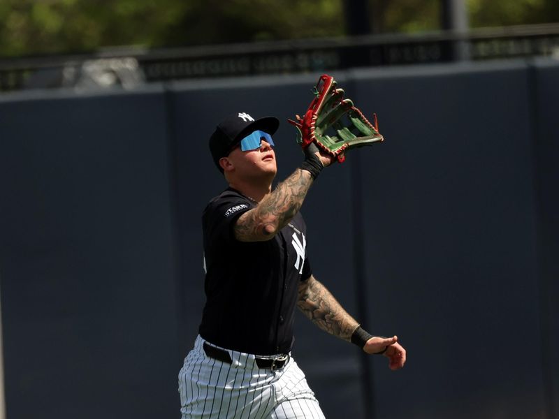 Mar 11, 2024; Tampa, Florida, USA;  New York Yankees right fielder Alex Verdugo (24) catches a fly ball during the second inning against the Baltimore Orioles at George M. Steinbrenner Field. Mandatory Credit: Kim Klement Neitzel-USA TODAY Sports