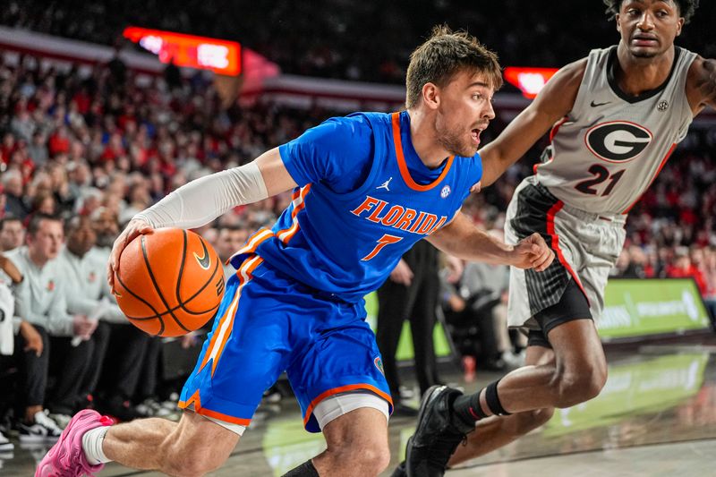 Feb 11, 2026; Athens, Georgia, USA; Florida Gators guard Urban Klavzar (7) dribbles against Georgia Bulldogs forward Jake Wilkins (21) during the second half at Stegeman Coliseum. Mandatory Credit: Dale Zanine-Imagn Images