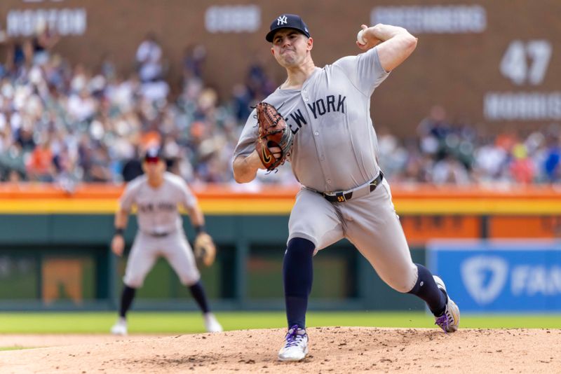 Aug 17, 2024; Detroit, Michigan, USA; New York Yankees starting pitcher Carlos Rodón (55) delivers in the first inning against the Detroit Tigers at Comerica Park. Mandatory Credit: David Reginek-USA TODAY Sports