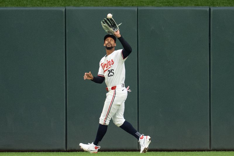 Jul 2, 2024; Minneapolis, Minnesota, USA; Minnesota Twins center fielder Byron Buxton (25) catches a fly ball hit by Detroit Tigers shortstop Ryan Kreidler (32) to retire the Detroit Tigers in the seventh inning at Target Field. Mandatory Credit: Matt Blewett-USA TODAY Sports