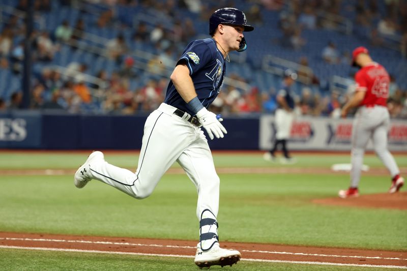 Sep 19, 2023; St. Petersburg, Florida, USA;  Tampa Bay Rays second baseman Curtis Mead (25) doubles against the Los Angeles Angels during the second inning at Tropicana Field. Mandatory Credit: Kim Klement Neitzel-USA TODAY Sports