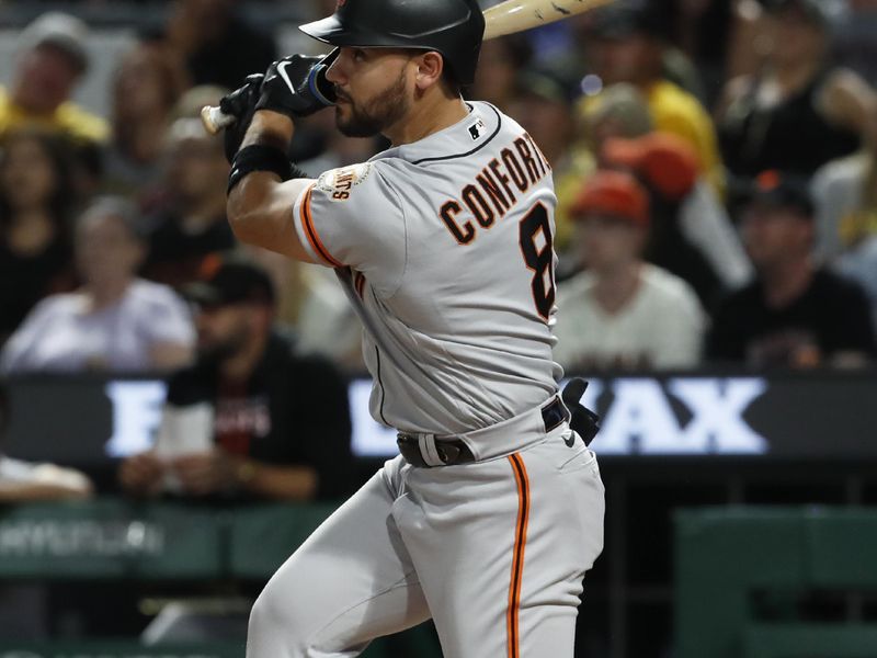 Jul 15, 2023; Pittsburgh, Pennsylvania, USA;  San Francisco Giants right fielder Michael Conforto (8) hits an RBI single against the Pittsburgh Pirates during the eighth inning at PNC Park. Mandatory Credit: Charles LeClaire-USA TODAY Sports