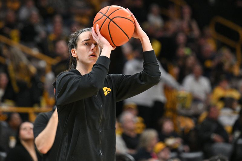 Mar 3, 2024; Iowa City, Iowa, USA; Iowa Hawkeyes guard Caitlin Clark (22) warms up before the game against the Ohio State Buckeyes at Carver-Hawkeye Arena. Clark is attempting to break the NCAA basketball all-time scoring record. Mandatory Credit: Jeffrey Becker-USA TODAY Sports