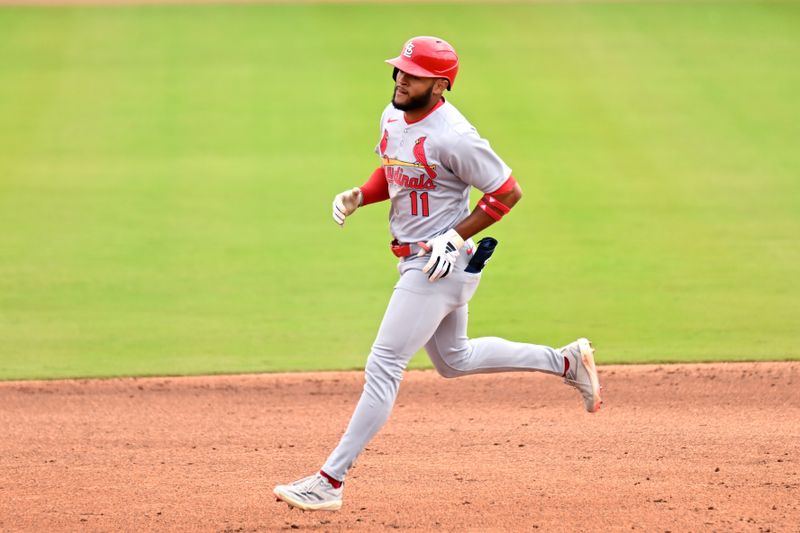 Feb 25, 2025; Dunedin, Florida, USA;St. Louis Cardinals left fielder Victor Scott II (11) rounds the bases after hitting a solo home run against the St. Louis Cardinals in the third inning of a spring training game at TD Ballpark. Mandatory Credit: Jonathan Dyer-Imagn Images